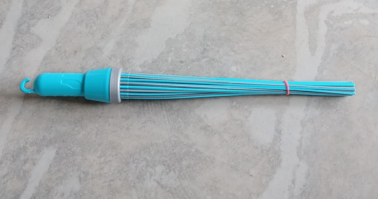Plastic broom for cleaning, showing bristles and base Plastic broom for cleaning, showing bristles and base